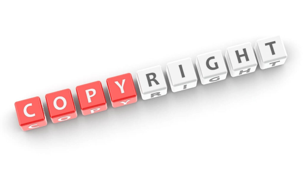 COPYRIGHTの文字が入ったサイコロの画像